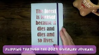 Flipping through the custom 2024 reading journal I made as a giveaway