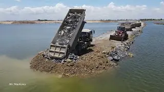 Awesome and cool road foundation building across the lake rock stone moving machine Loader & Truck