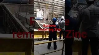 Removing zinc dross.