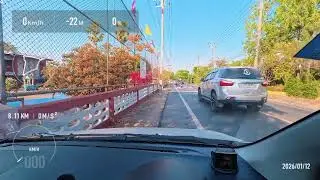 Driving along the road in a Suzuki Celerio, filming with Insta360 GO Ultra.