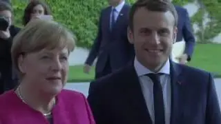 German Chancellor Angela Merkel welcomed new French President Emmanuel Macron