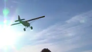 STOL Airplane landing on a dirt road