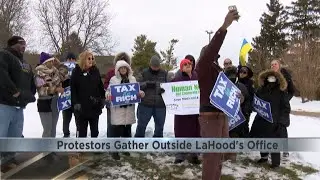 Protestors gather outside Congressman LaHood's office in support of Affordable Care Act: The