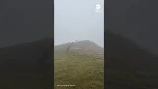 Man struggles to stay upright as powerful winds hit France