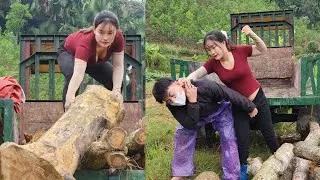 Agricultural vehicle transporting wood. What are these two people doing? Let's go take a look.