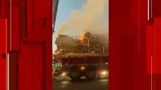 Log house 1776 catches fire