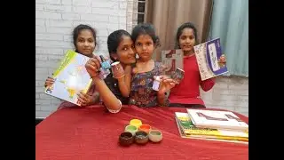solving world map puzzle||telling about the things we bought||books|| world map|| glass cups||