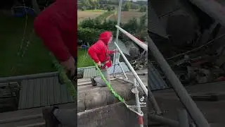 Climbing down the back of a chimney scaffold. #construction #scaffold #shorts