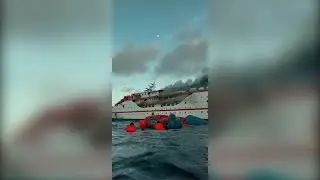 Indonesia ferry catches fire, passengers jump to sea