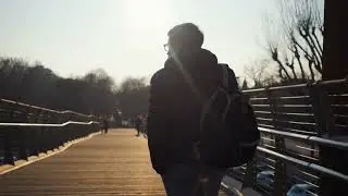 Boy Walking on bridge in evening | Stock Video | Walking Cinematic Video | Pixadisc