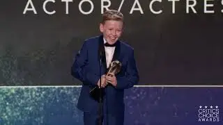Jude Hill accepts his best young actor award at the 27th Annual Critics Choice Awards