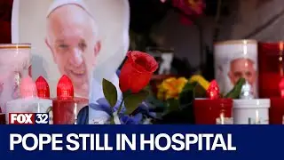 Pope Francis is alert, but in pain after hospitalization, Vatican says