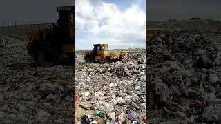 KOTAI garbage compactor is working on the garbage dump site!
