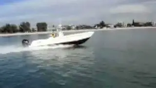 Contender 33T Stepped Hull cruising down the beach