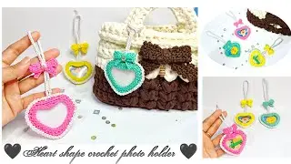 Crochet heart-shaped photo holder with crochet ribbon decoration