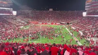 Nebraska fans rush field after 44-25 win over Wisconsin.