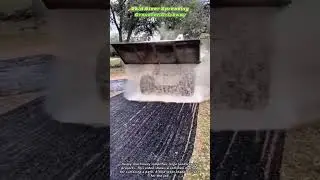 Skid Steer Spreading Gravel on Driveway