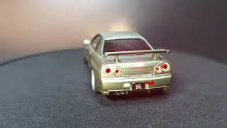 Kyosho dnano Nissan GT-R R34 V-spec II N&uuml;r RB26 model in 1:43 with light