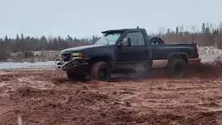 1991 Chevy Stepside donuts in the mud.