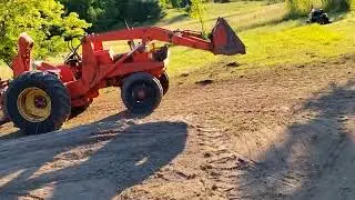 level land - tractor, blocks, old box spring, string
