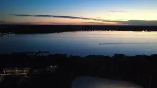 Peaceful Lake Sunset With a Boat Gliding By | DJI Mini 4K Aerial