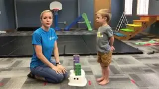 Physical Therapy Exercise: Standing on one leg to kick over blocks