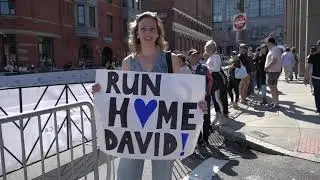 Spectators celebrate the 2024 Boston Marathon