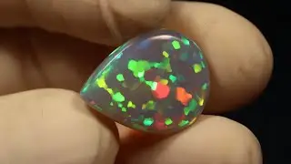 Dark purple base Ethiopian Welo opal pear shaped cabochon with stunning hexagonal honeycomb pattern