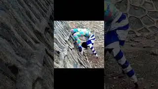 Fitness Contortionist Boy in Tanzania. stretching on using the wall