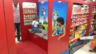 Kid playing in toy train