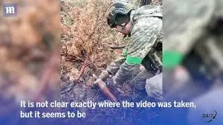 Russian shell nearly blows up Ukrainian troops as they try to defuse unexploded bomb