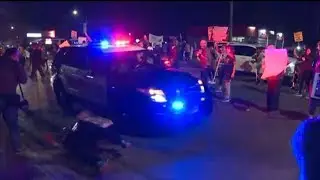 Police vehicle knocks down elderly protestor during rally for Stephon Clark