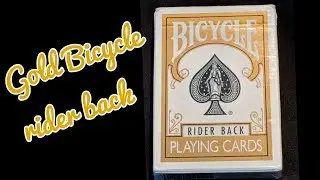 Deck Review - Gold bicycle rider back