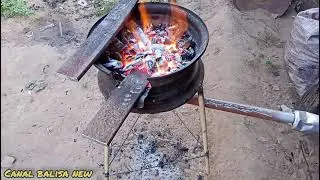 forja caseira a carv&atilde;o  com roda de carro