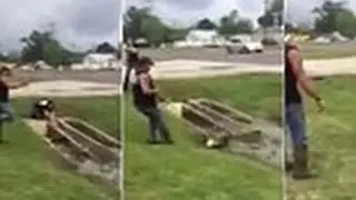 Gary Saurage tackles a huge alligator in backyard pond