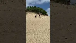 Playing on the Sand Dunes at Kill Devil Hills North Carolina