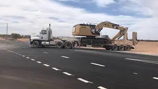 Mack CHR Low Loader moving a Cat 324EL Excavator