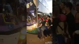 Chinese mainlanders trying to get on a bus in Hong Kong - 2019