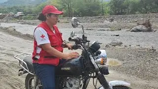 Reaching the affected communities from Hurricane Celia by motorbike