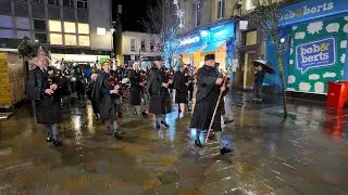 Drum Major leads Perth Pipe Band playing Green Hills during 2023 Christmas Lantern Parade