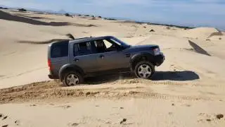 Land Rover Discovery 3 driving in sand dunes