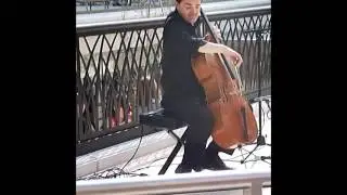 Permformer at City Creek playing Rolling In The Deep on a cello.