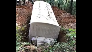 School bus underground survival bunker Part 5. Placing the Bus in the hole