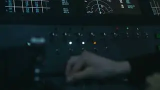 VideoVault Stock Video: Buttons are pressed and switches are activated in a spaceship