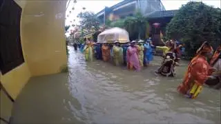 Vietnamese Funeral through the Flooded Streets of the Hoi An Ancient Town