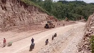Building New Road Foundation by Motor Grader Pushing Limestone Dirt, Vibro Roller and Excavator.