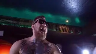 Conor mcgregor tearing poster