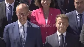 Ministers and leaders pose for family photo during Franco-German cabinet meeting