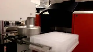 Hudson PlateCrane EX Loading a Microplate Centrifuge
