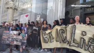 Black Lives Matter protesters march against police violence in Oakland, Calif., on Friday, July 15,